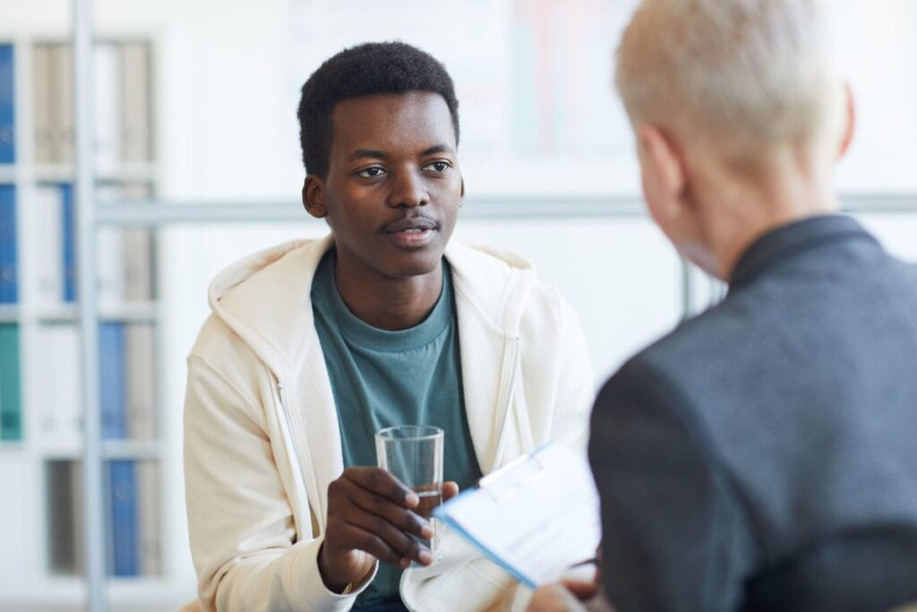 man dressing substance abuse with a young adult seeking Addiciton treatment