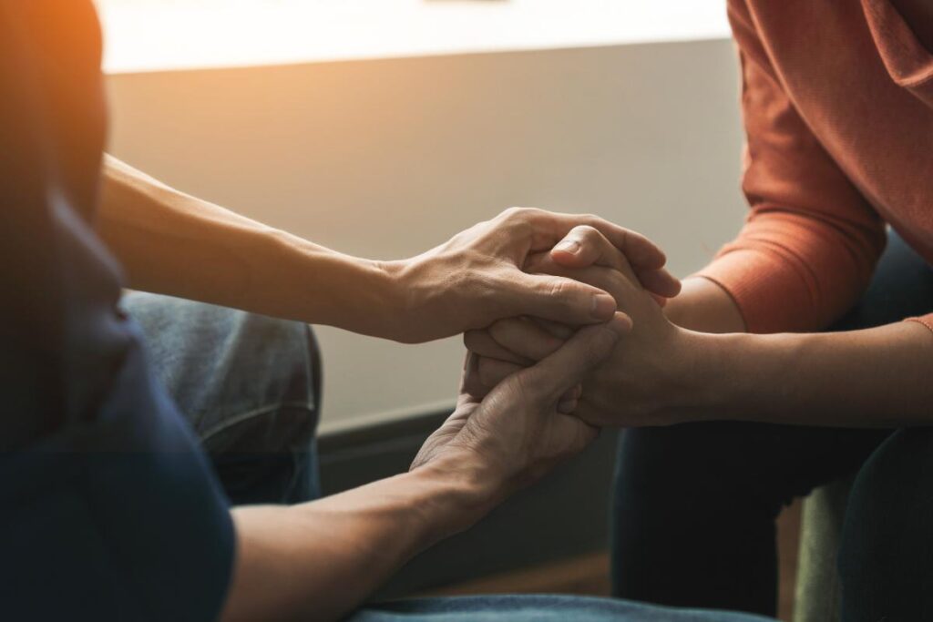 two people holding hands