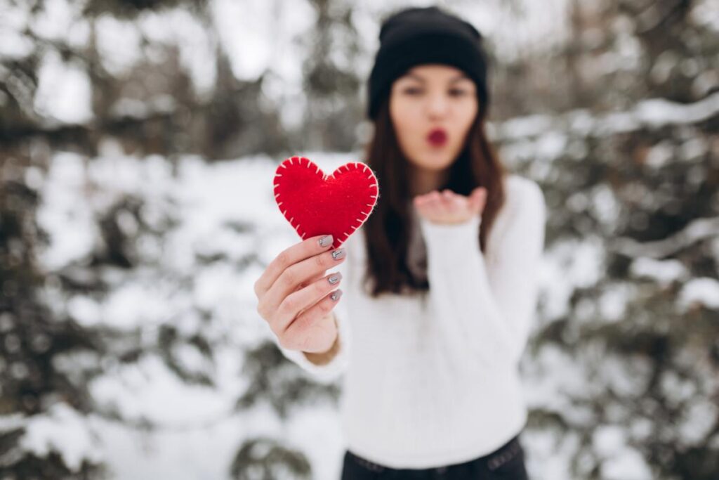 girl holding red heart