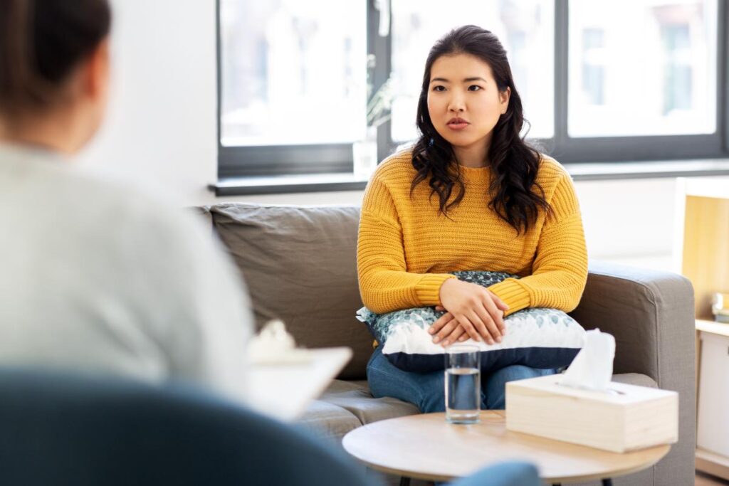 woman sitting on couch