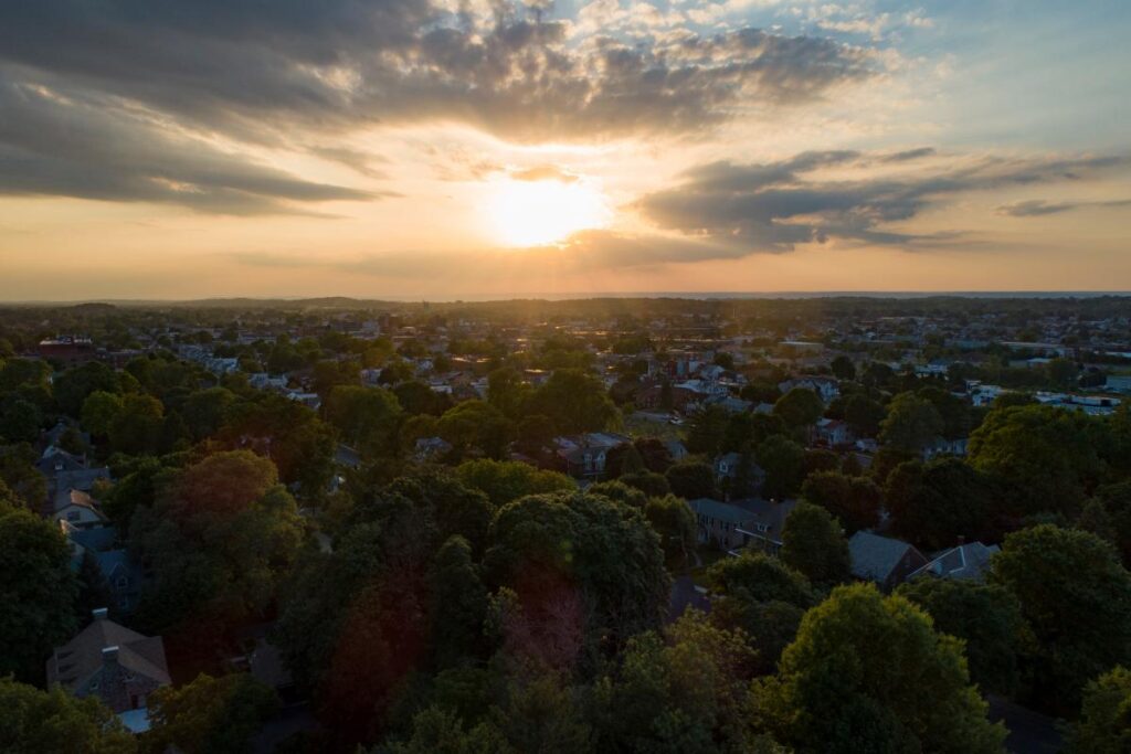 beautiful sunset over the trees and buildings of lebanon pa