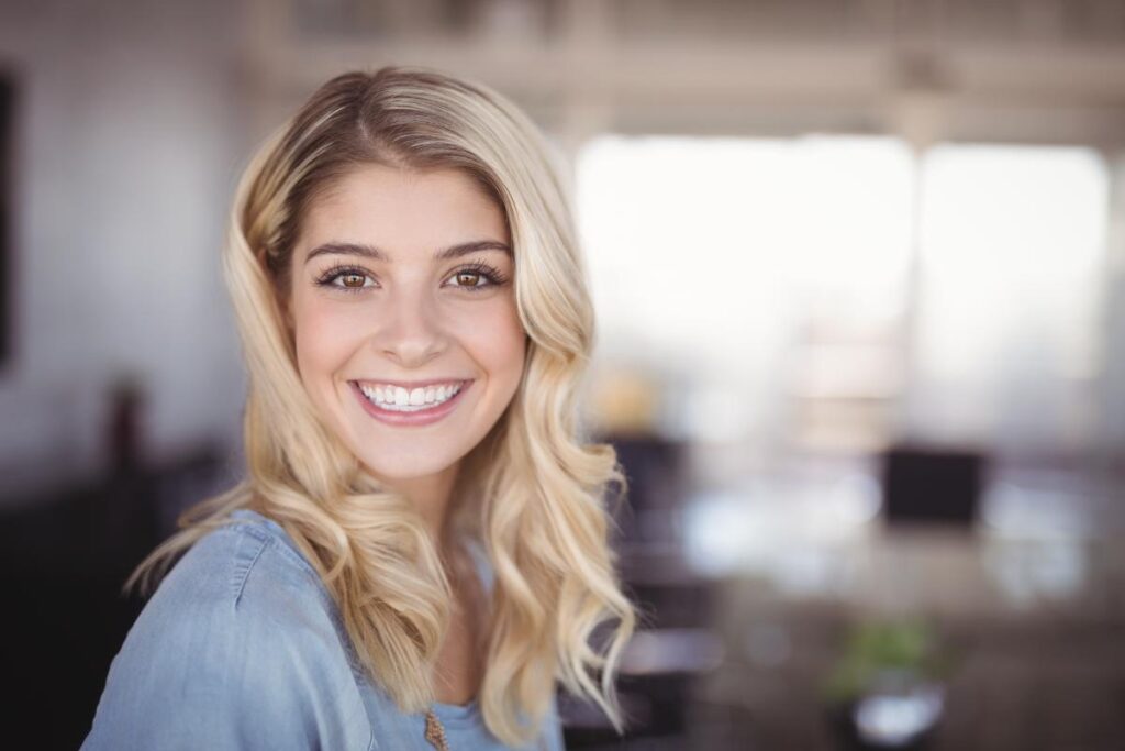 smiling woman relieved she found help after searching for a rehab for women near adams pa