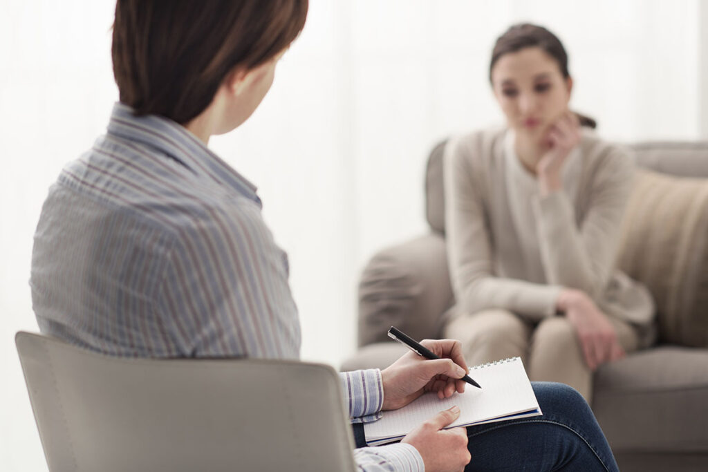 a therapist offering York addiction services talks to someone