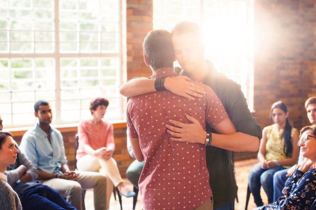 people engage in group therapy and learn about group therapy benefits