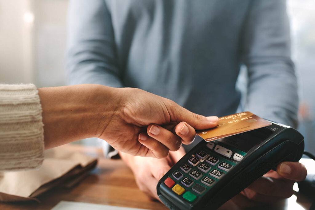 close up of a person working a calculator to determine how to pay for the average cost of a partial hospitalization program