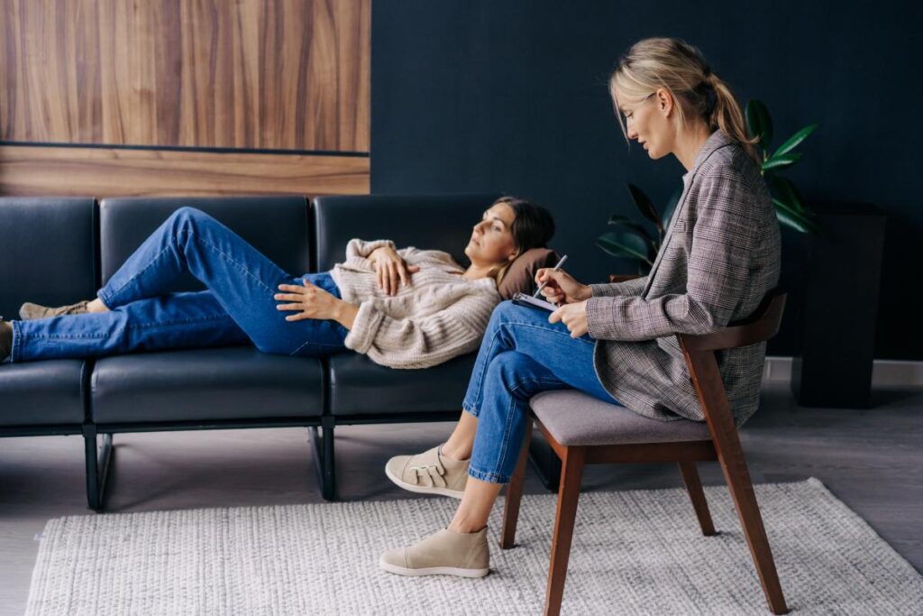 a woman is able to open up and get to the root cause of her addiction in individual therapy during treatment