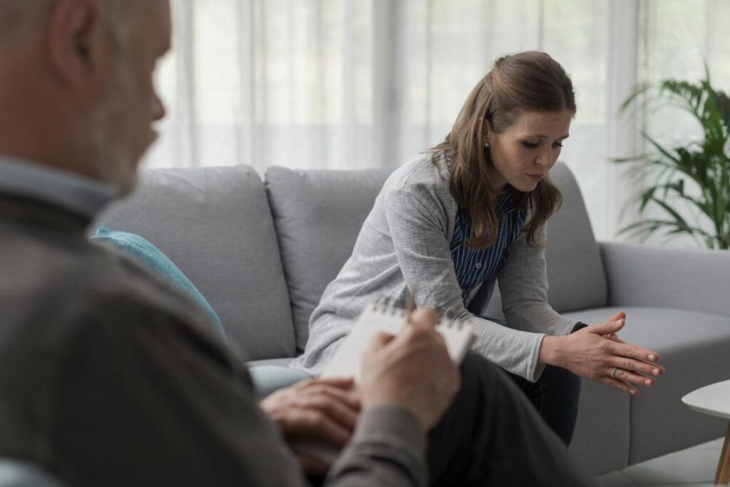 a patient discusses the causes of polysubstance abuse with a therapist