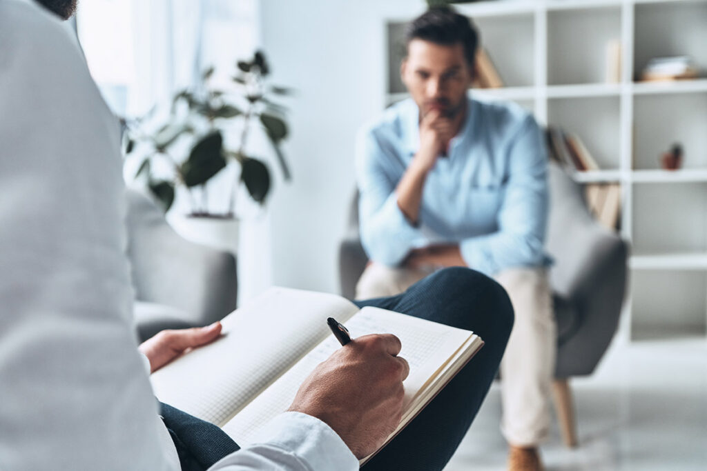 Man learning about treatment options for substance abuse