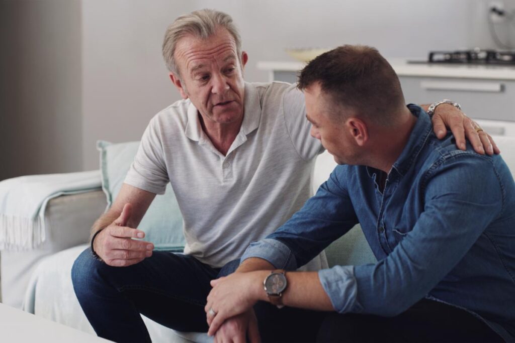 person sitting on couch helping a loved one with cocaine addiction