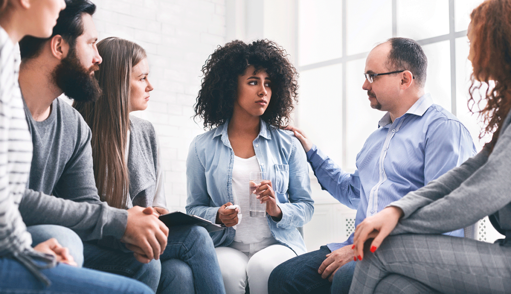 A woman shares her story in an addiction therapy program in Mechanicsburg, PA.
