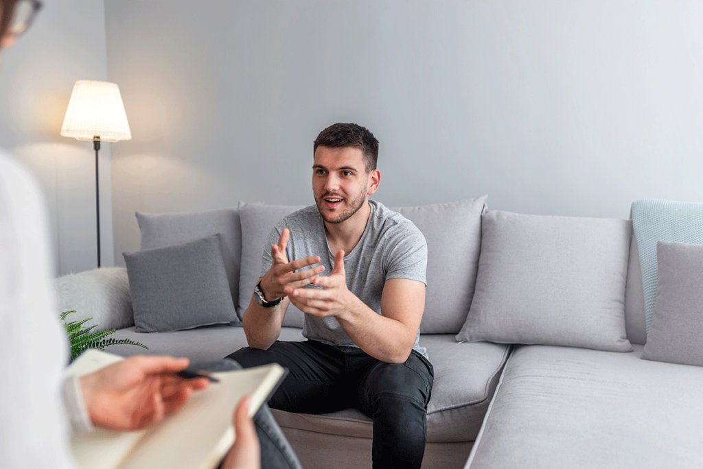 A man is asking about PHP vs. IOP and learning about the differences and benefits of both.